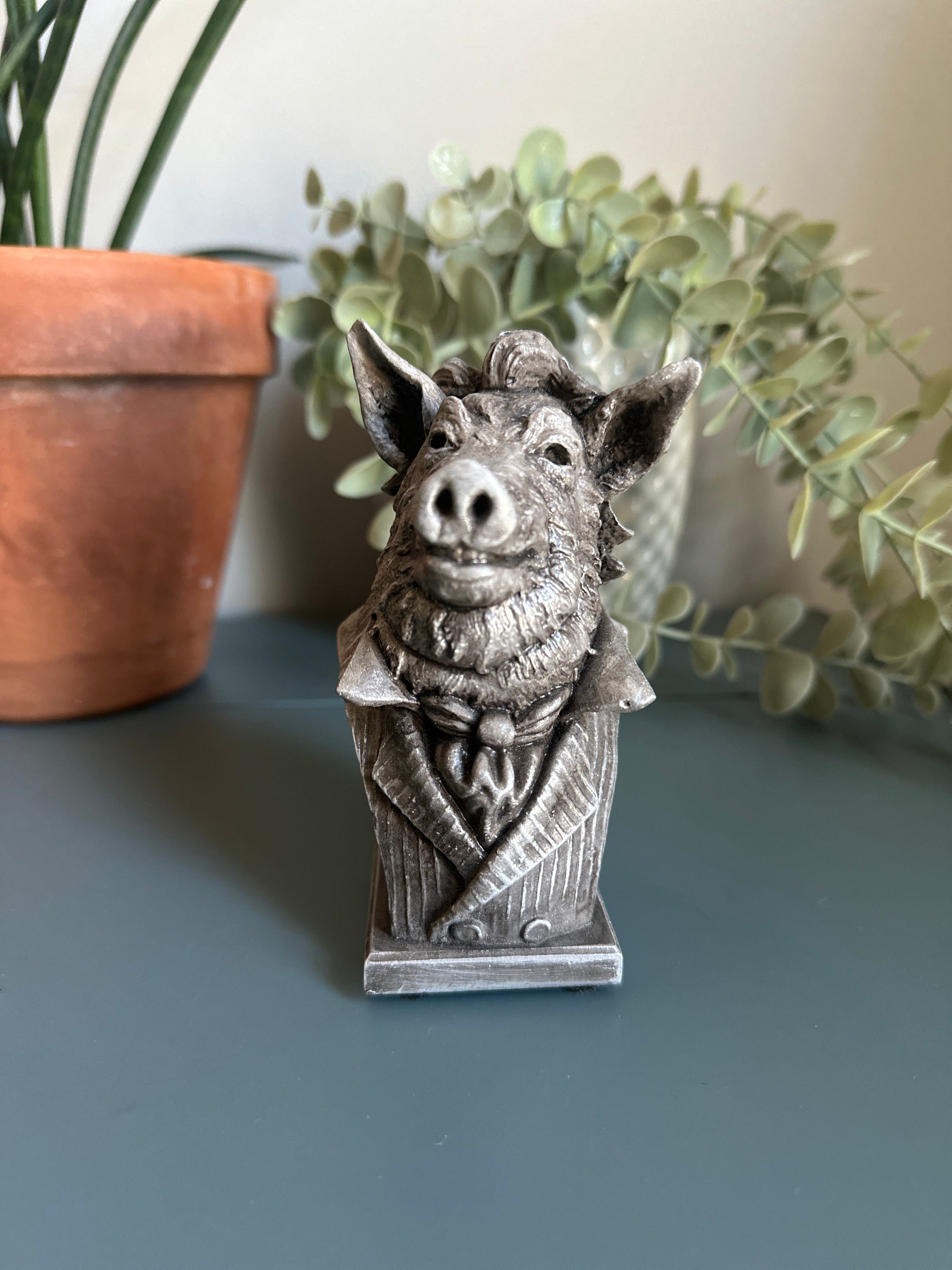 Our charming pig sculpture in a desktop scene