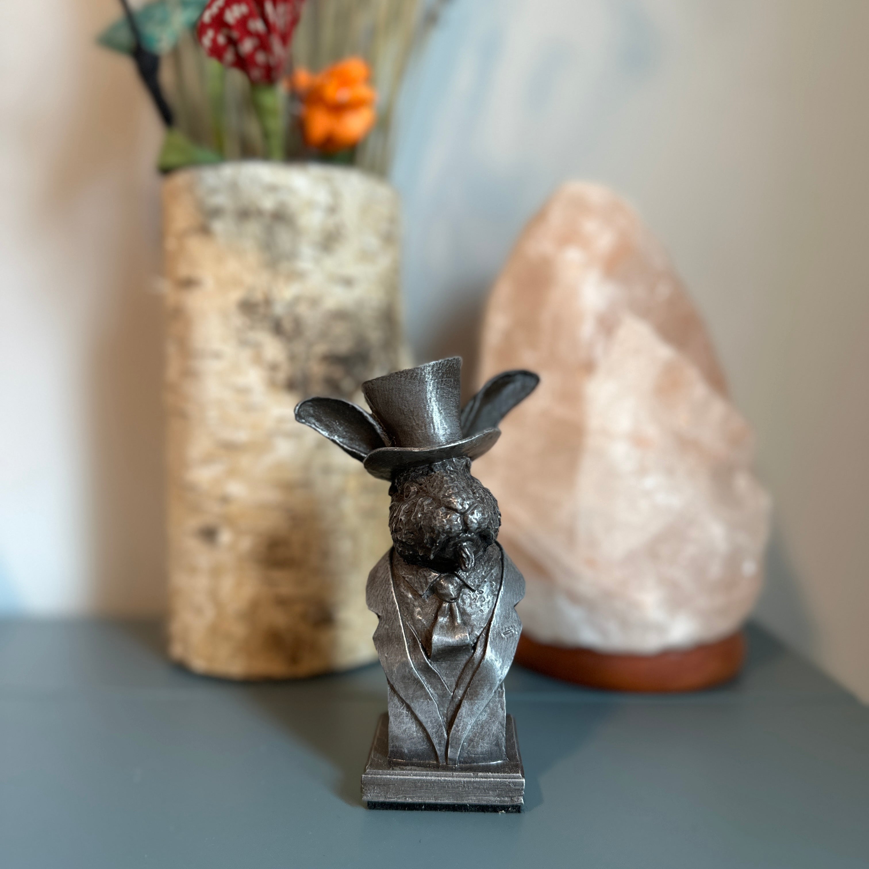 Handcrafted rabbit sculpture shown on desk