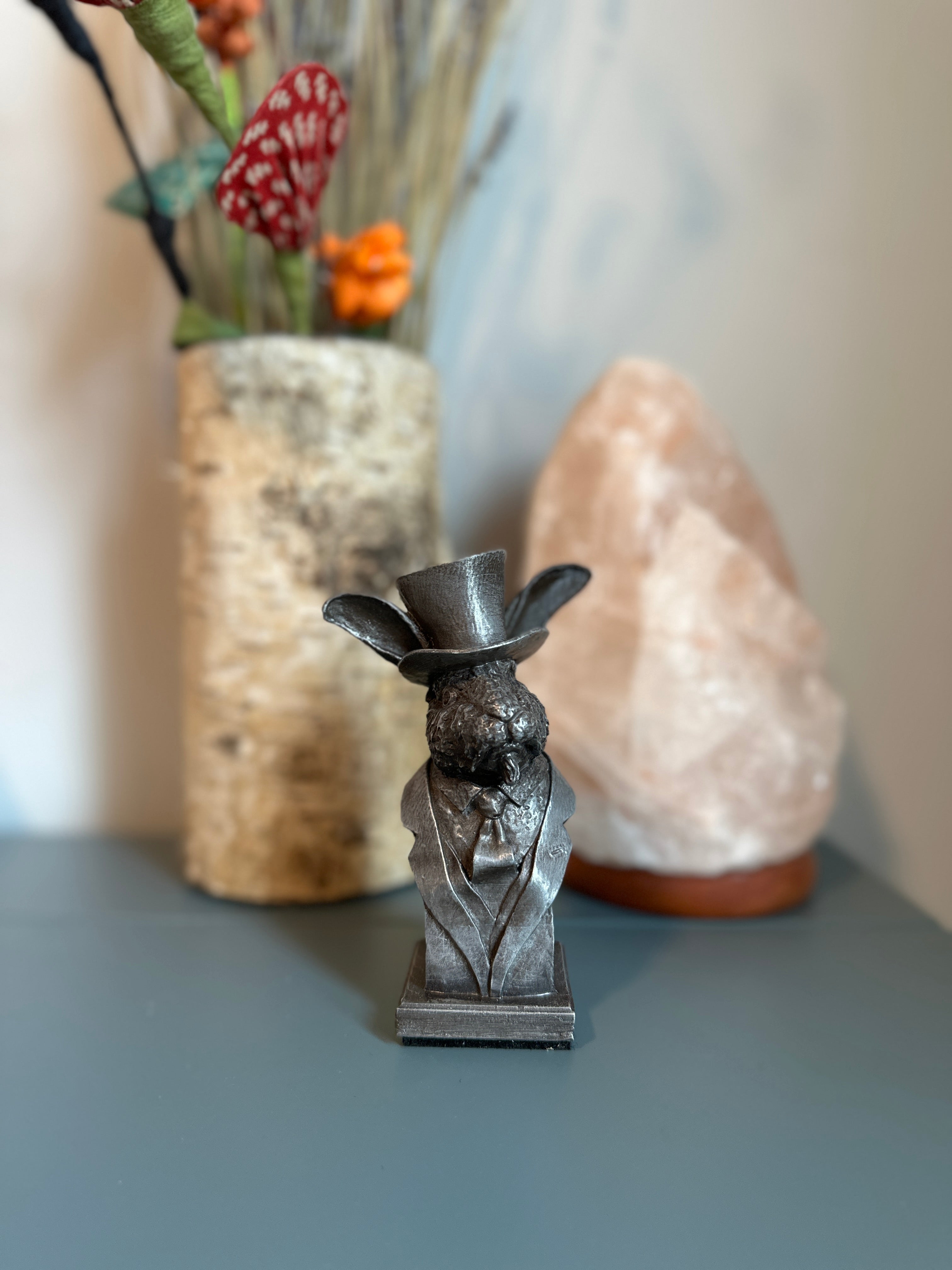 Handcrafted rabbit sculpture shown on desk