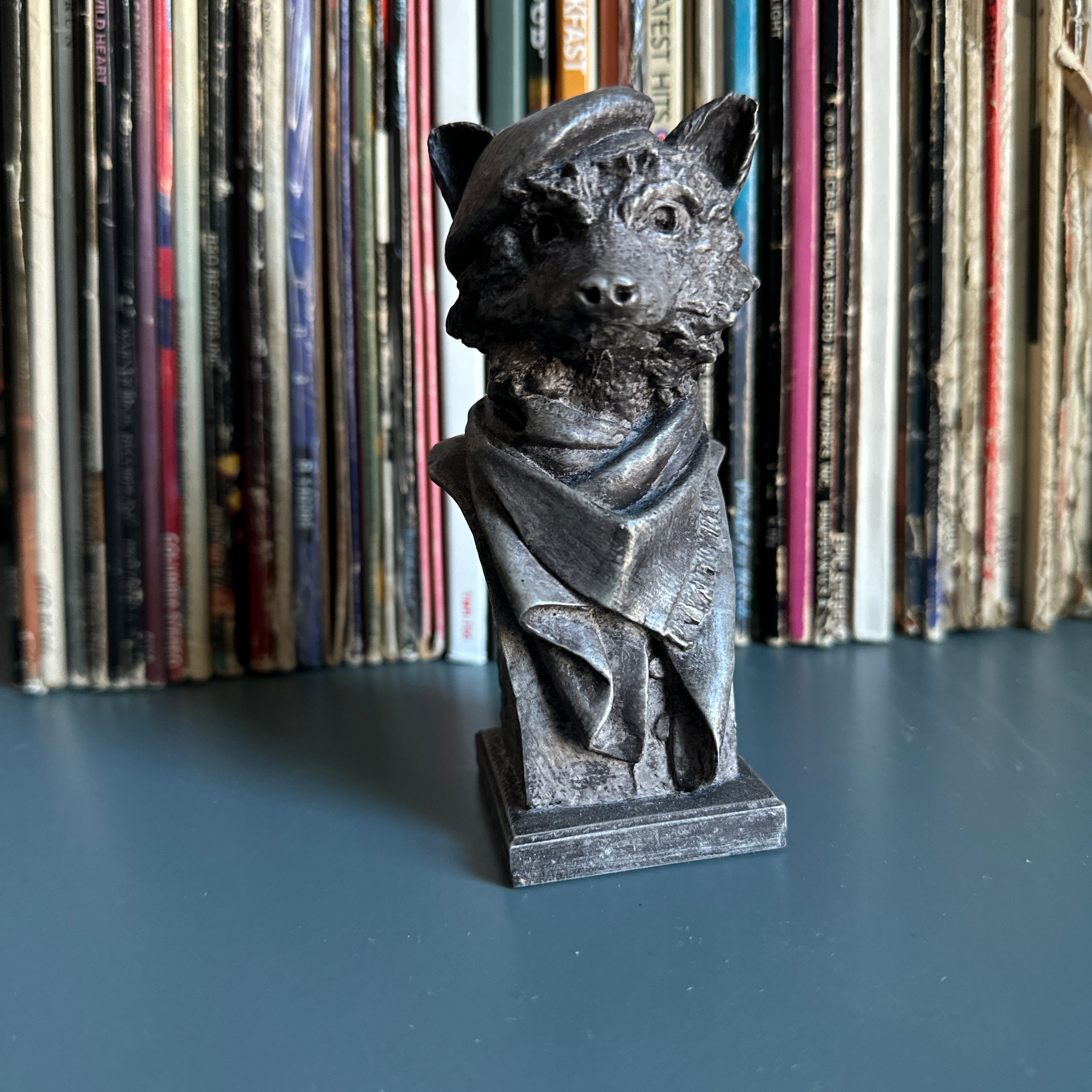 Tabletop raccoon sculpture. Artist-made, collectible sculpture bust, pictured on desk.