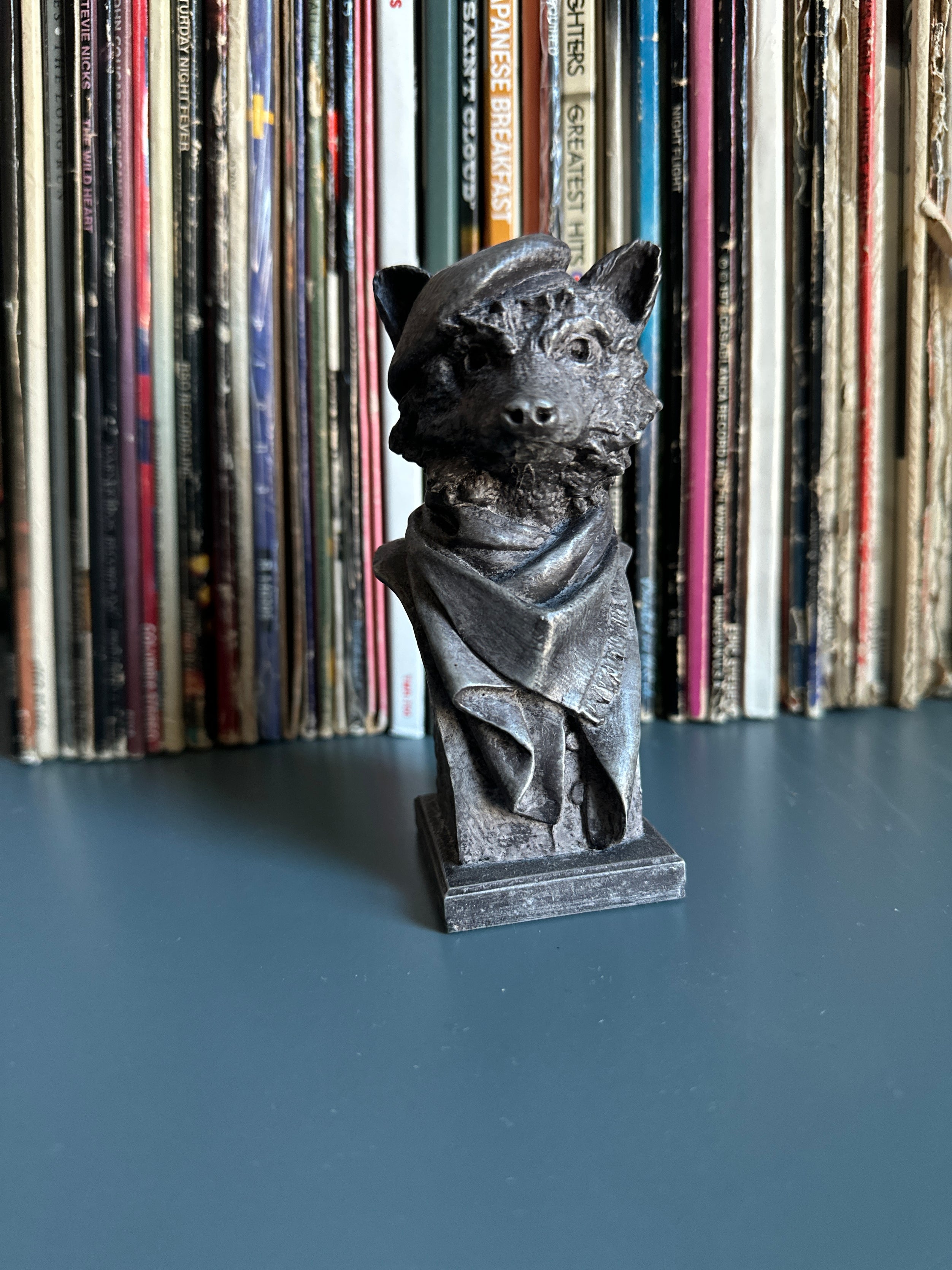 Tabletop raccoon sculpture. Artist-made, collectible sculpture bust, pictured on desk.