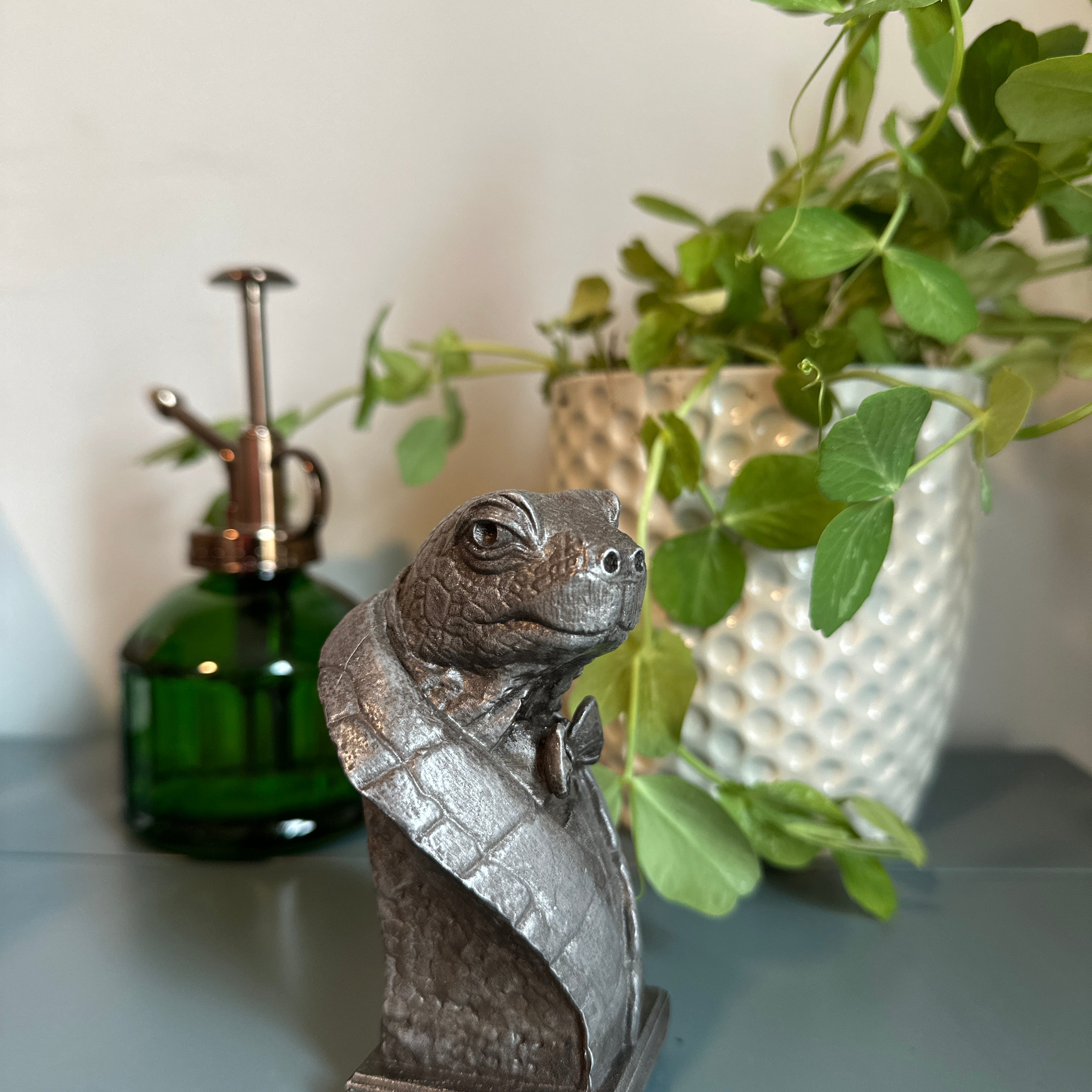 Handcrafted tabletop turtle sculpture on desk. Handcrafted in cold-cast aluminum for collecting and gifting.