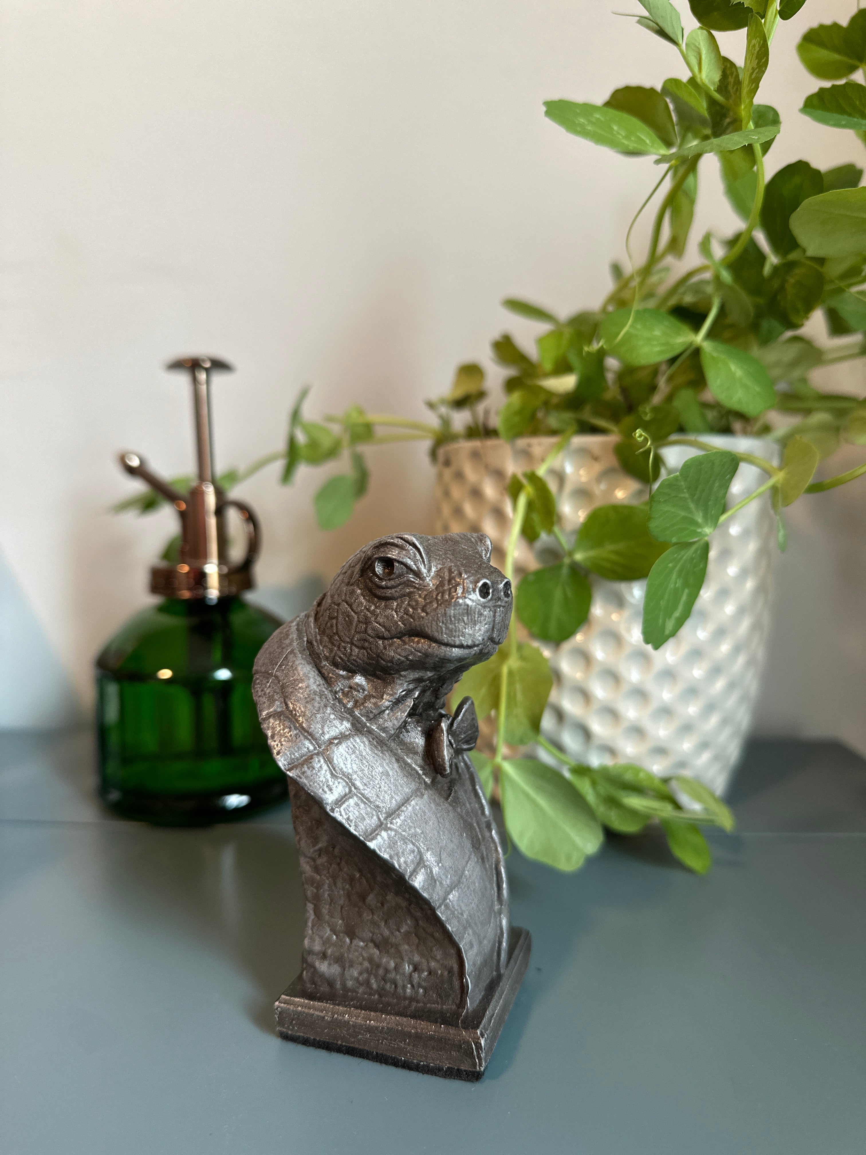 Handcrafted tabletop turtle sculpture on desk. Handcrafted in cold-cast aluminum for collecting and gifting.